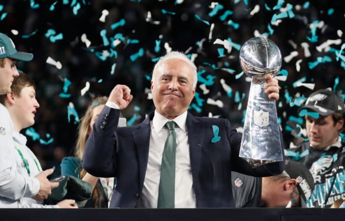 Eagles owner Jeff Lurie holds the Lombardi Trophy after Super Bowl LII